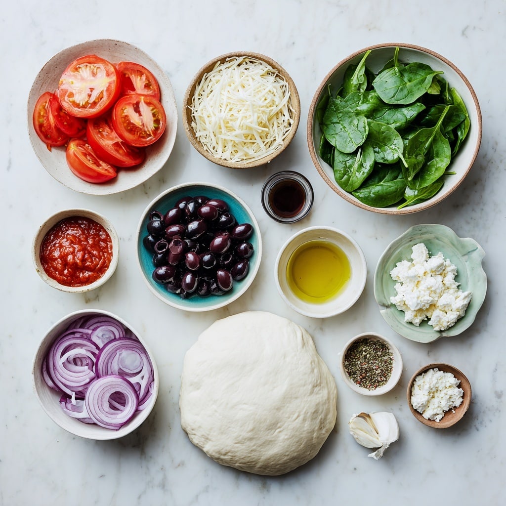 The image shows an uncooked pizza on white parchment paper over a white marbled surface. The pizza has a thick, light golden dough crust. The base layer is a red tomato sauce, lightly spread near the edges. On top of this is a thin layer of white shredded cheese covering most of the base, except the crust. Over the cheese, there are thin round slices of red tomatoes spread all over. Fresh dark green spinach leaves are scattered evenly across the pizza, along with slices of black olives and curved thin light purple rings of onion. Crumbled white cheese is sprinkled generously on top of all the other layers, adding texture and contrast. Photo taken with an iphone --ar 4:5 --v 7