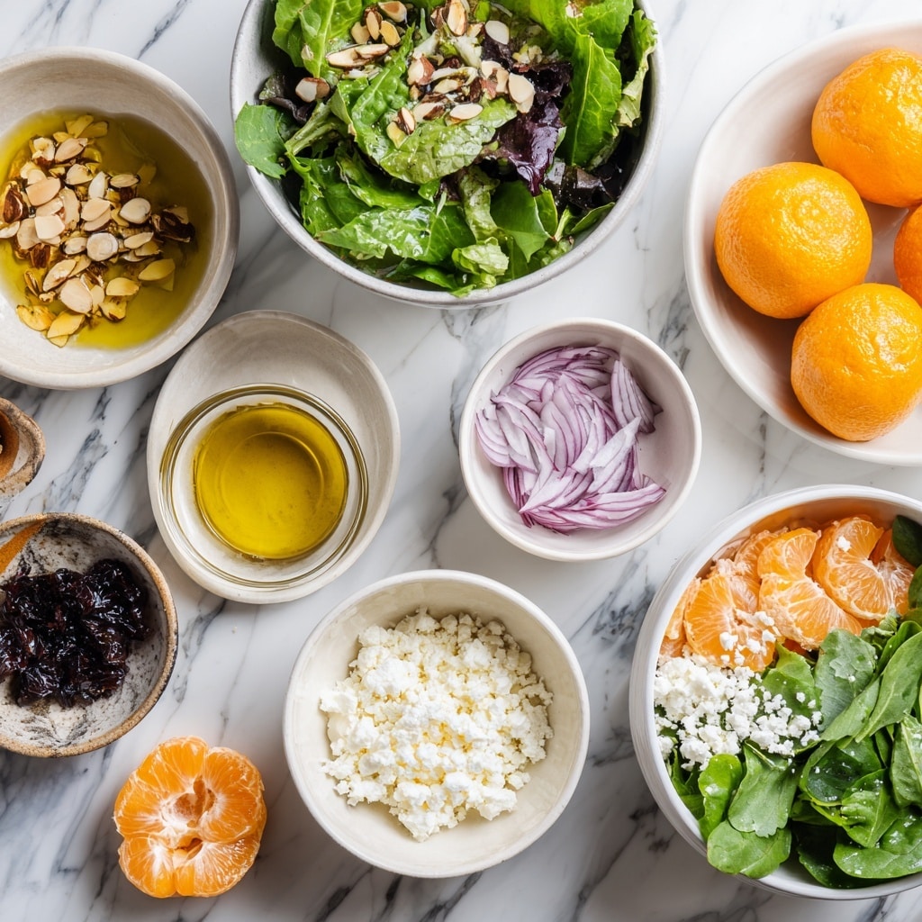 A white bowl filled with fresh baby spinach leaves forms the base layer, creating a rich green background. On top, there are evenly spaced vibrant orange mandarin slices mixed with deep red blood orange slices, adding bright pops of color. Small, crumbly white cheese pieces are scattered across the citrus and spinach layers, giving a soft texture contrast. A few sprigs of delicate green herbs are lightly placed for garnish. The bowl is set on a white marbled surface, enhancing the fresh and clean look of the salad. photo taken with an iphone --ar 4:5 --v 7