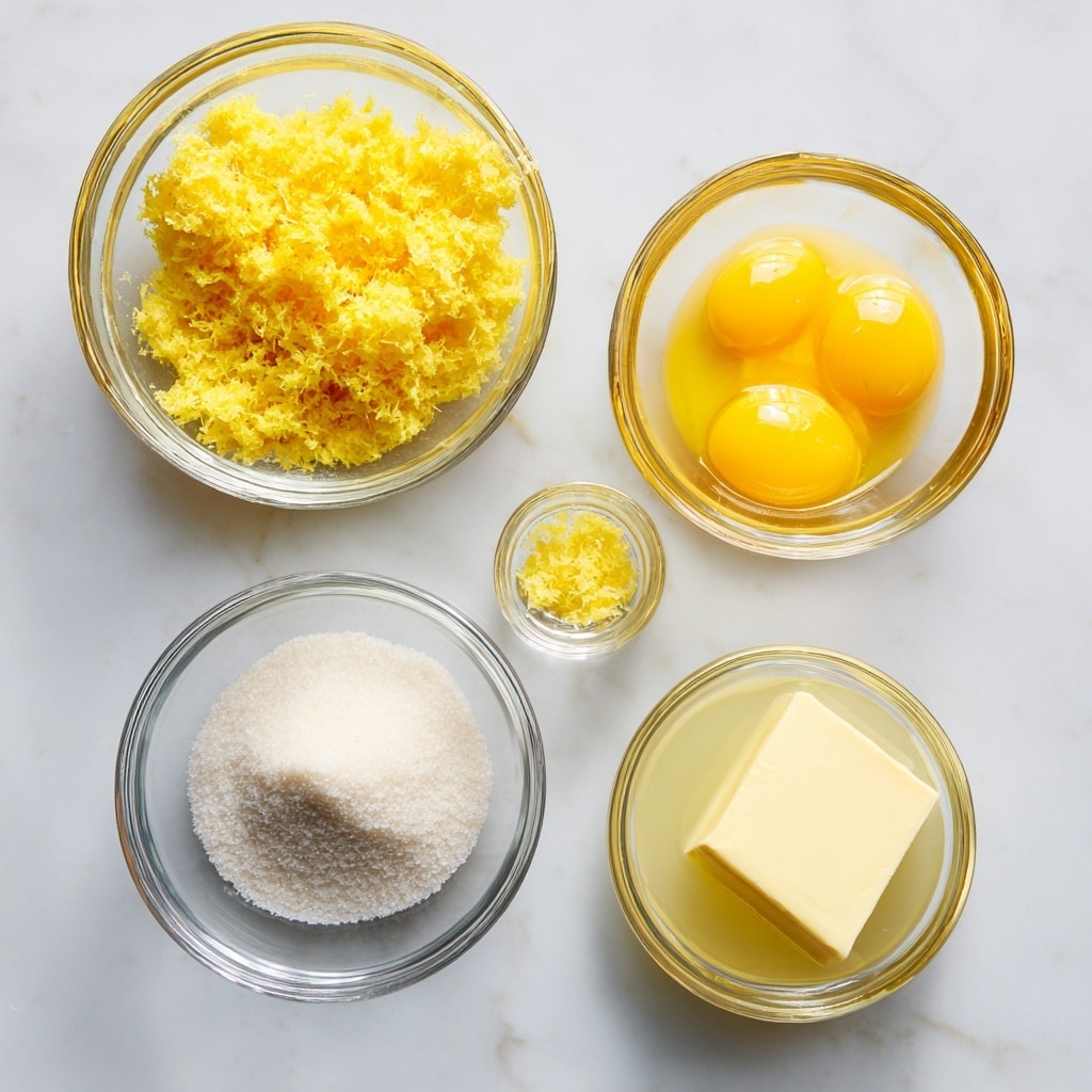Five small clear glass bowls sit on a white marbled surface. The top left bowl holds bright yellow lemon zest with a rough texture. To the right, a bowl filled with smooth, shiny, bright yellow egg yolks is placed. Below the lemon zest is a bowl full of fine, white granulated sugar. A small bowl with a pale yellow solid butter square is next to it. At the bottom right, another clear glass bowl containing translucent light yellow lemon juice completes the arrangement. All bowls are spaced evenly and shown from above, giving a clean and fresh look. photo taken with an iphone --ar 4:5 --v 7