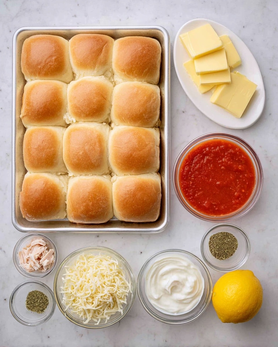 A tray of 12 golden brown soft dinner rolls arranged in 3 rows of 4 is placed on the left side, with a white marbled surface underneath. To the right, there is a small white oval plate holding six slices of pale yellow butter. Below that, there are several small clear glass bowls: one with shredded white cheese, one with chopped light cooked chicken, one filled with smooth red tomato sauce, another one containing white creamy sour cream, and two small bowls with various dried green and beige spices. A bright yellow whole lemon rests beside the spices, completing the neat ingredient arrangement. Photo taken with an iphone --ar 4:5 --v 7