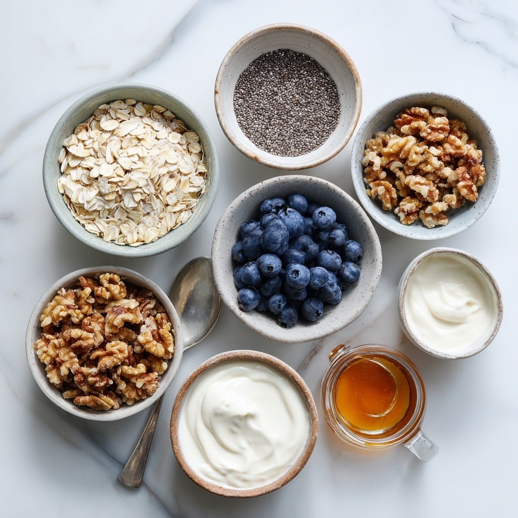 The image shows a white bowl on a white marbled surface filled with three main layers of food arranged in a circular pattern. One side has a creamy oatmeal layer with a soft and slightly lumpy texture in off-white color, taking about one-third of the bowl. Next to it is a thick, dark purple mixed berry sauce layer with visible whole berries and a shiny texture, covering another third of the bowl. In the center, a smooth round swirl of golden brown peanut butter sits over parts of both the oatmeal and berry layers. Small clusters of granola sprinkled mainly over the oatmeal and berries create texture and contrast. Photo taken with an iphone --ar 4:5 --v 7