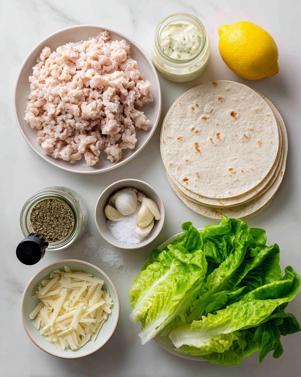 The image shows ingredients arranged on a white marbled surface, all labeled with clear text. At the top left is a white plate holding pale pink ground chicken, with a bright yellow lemon next to it on the right. Below the chicken is a small glass jar filled with creamy Caesar dressing, and next to it on the left is a black-capped jar of green Italian seasoning. Below the dressing jar is a small bowl with white salt, and beside it are three peeled garlic cloves. At the bottom left is a small bowl of pale yellow Parmesan cheese slices. To the right, there are three large white corn tortillas stacked, topped with fresh crisp green lettuce leaves. The whole setup is clean and well-organized, brightly lit to show the colors and textures clearly. photo taken with an iphone --ar 4:5 --v 7