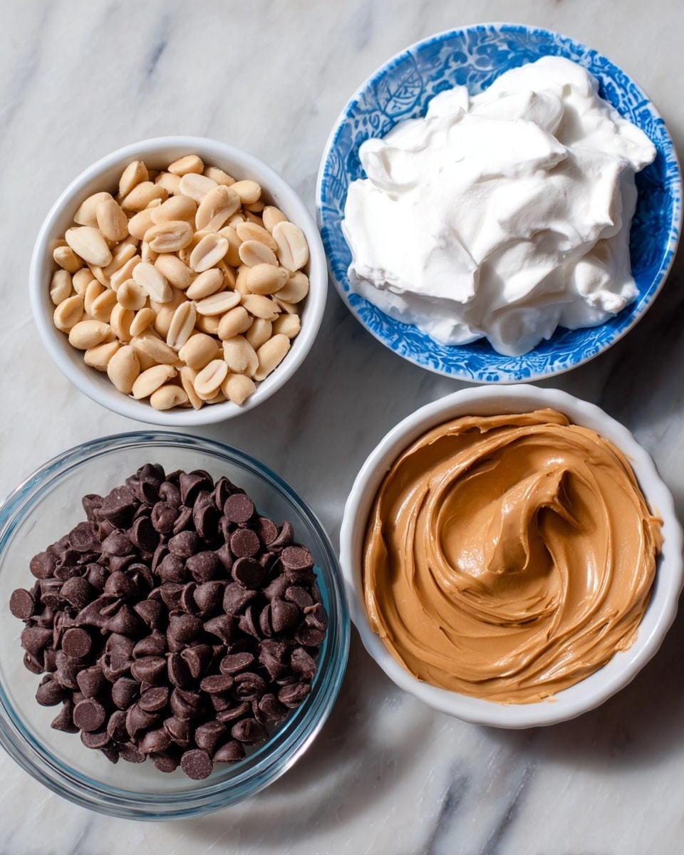 The image shows four bowls each with a different ingredient placed on a white marbled surface. The top bowl is white with a blue pattern and filled with light beige peanuts. Below it, to the left, is a white bowl with a blue rim containing fluffy white whipped cream. To the right of the whipped cream is a clear glass bowl full of smooth, shiny dark brown chocolate chips. At the bottom center is a plain white bowl holding thick, creamy light brown peanut butter with swirled texture. Photo taken with an iphone --ar 4:5 --v 7