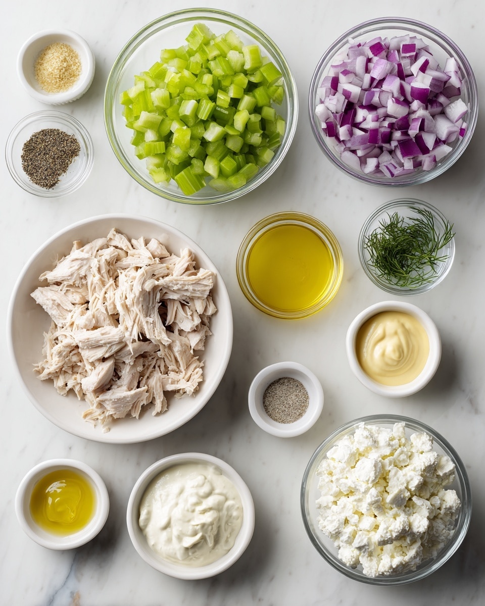 The image shows several small white bowls and clear glass bowls with different ingredients arranged neatly on a white marbled surface. At the center, there is one white bowl filled with shredded light beige chicken. Above it, a clear glass bowl holds chopped bright green celery, and to its left, another clear glass bowl contains chopped red onion in purple and white colors. To the right of the celery bowl, a small white bowl is filled with yellow Dijon mustard. Surrounding these main bowls are smaller white bowls: one with coarse black pepper, one with light yellow garlic powder, one with fine white salt, and one with light creamy avocado oil mayo. At the bottom right, a white bowl holds lumpy white cottage cheese, and to its left, a small white bowl has pale yellow lemon juice. Above the salt bowl, a tiny bowl contains green dill leaves. The layout is clear and organized, all on the white marbled surface. photo taken with an iphone --ar 4:5 --v 7