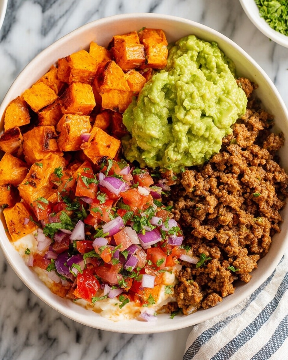 A white bowl filled with four layers: bright orange cubed roasted sweet potatoes on the top left, chunky green guacamole with cilantro on the top right, fresh pico de gallo made of red tomatoes, purple onions, and green cilantro in the center, and crumbly cooked brown ground meat on the bottom left, with a creamy white sauce drizzled lightly on the bottom right. The bowl is set on a white marbled surface with a textured white cloth underneath, photo taken with an iphone --ar 4:5 --v 7