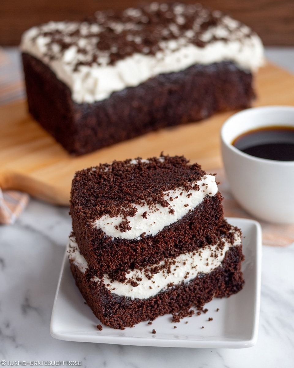 The image shows a close-up of a chocolate layer cake cut into multiple thick slices stacked on top of each other. Each slice has two layers: a dark, moist chocolate cake layer on the bottom and a bright white creamy frosting layer on top sprinkled with finely crushed chocolate crumbs. The texture of the cake looks soft and crumbly, while the frosting appears smooth and slightly fluffy. The cake slices are placed on a light wooden surface but should be imagined over a white marbled texture. Photo taken with an iphone --ar 4:5 --v 7