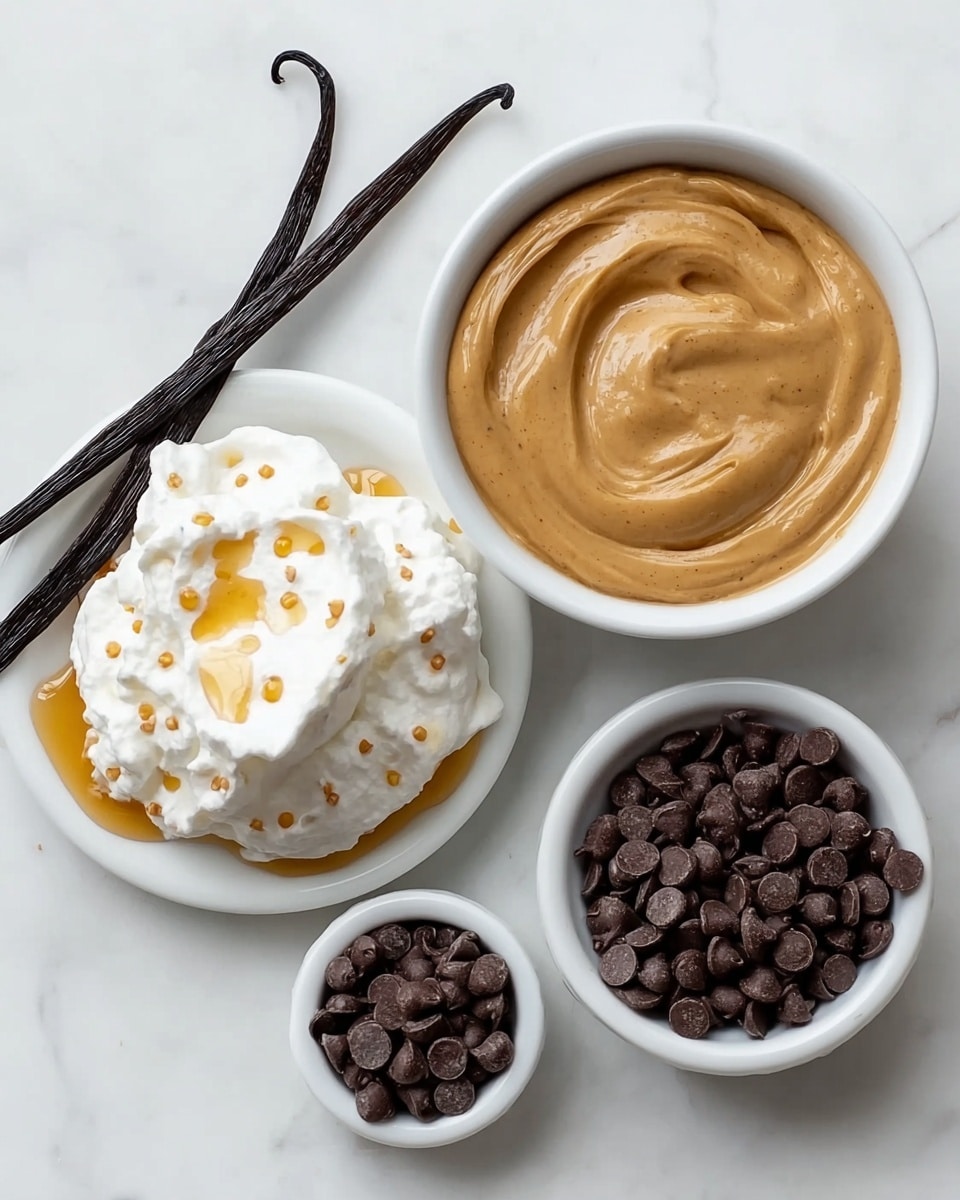 The image shows four items on a white marbled surface: in the center, there is a white bowl filled with smooth, light brown peanut butter with a small swirl in the middle; to the left, a white plate holds a dollop of white whipped cream topped with small black vanilla bean specks and drizzled with golden honey, with two dark vanilla bean pods resting above the cream; on the right side, there are two small white bowls, each filled with dark brown chocolate chips. photo taken with an iphone --ar 4:5 --v 7