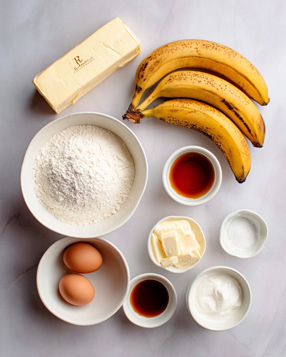 The image shows a flat lay of baking ingredients placed on a white marbled surface. There are three ripe bananas with brown spots positioned diagonally. Above the bananas lies a stick of unsalted butter with a beige wrapper. To the upper right, a small white bowl contains a brown liquid, likely vanilla extract. Close by, a white bowl has two eggs, one brown and one white, sitting next to it. A white bowl with white sour cream is centrally placed below a large bowl filled with white flour. To the left of the flour bowl, a white bowl filled with white granulated sugar is visible. Finally, a small white bowl with a pinch of white salt is on the upper right side. The setup is neat and organized, with soft lighting highlighting the textures and colors of each ingredient. photo taken with an iphone --ar 4:5 --v 7