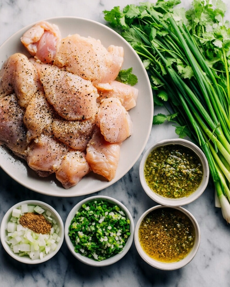 A white plate filled with raw chicken pieces seasoned with black pepper sits on a white marbled surface. To the right, three small white bowls contain green sauce, minced garlic with chopped green chili, and a blend of dry spices including ground cinnamon, dried herbs, and a powdered ingredient. Fresh green onions and a bunch of fresh cilantro lie next to the bowls on the white marbled background. The colors range from the pale pink chicken to the vibrant green herbs and the yellowish spices, creating a fresh and organized layout. Photo taken with an iphone --ar 4:5 --v 7