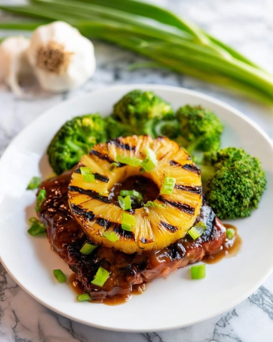 A white plate holds a piece of grilled meat as the base layer, topped with a large, circular grilled pineapple ring with dark grill marks, placed neatly on top. The meat is covered in a glossy brown sauce, with small pieces of green onion scattered over both the pineapple and meat. Surrounding the meat on the plate are several bright green broccoli florets, adding a fresh color contrast. In the background, green onions and garlic rest on a white marbled surface, adding a fresh and natural touch to the scene. The photo is taken with an iphone --ar 4:5 --v 7