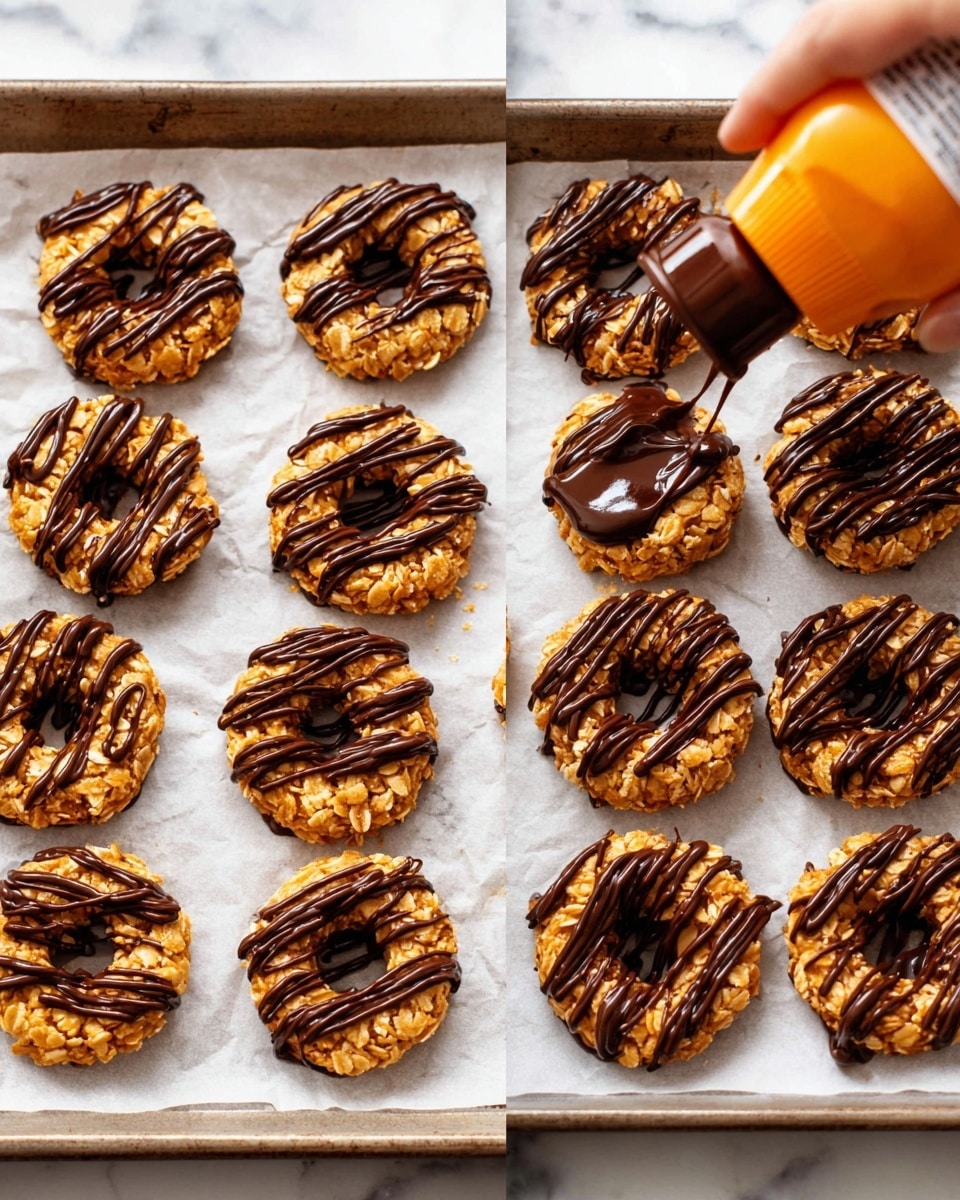 The image shows round treats made from a sticky, golden oat-like layer shaped into rings with a hollow center, arranged in neat rows on white parchment paper over a baking sheet. Each ring is topped with smooth dark chocolate drizzles in thin stripes crossing the top horizontally. On the left side, a woman's hand is squeezing chocolate from an orange-tipped bottle over one of the oat rings, adding more chocolate lines. The baking sheet rests on a white marbled surface. photo taken with an iphone --ar 4:5 --v 7