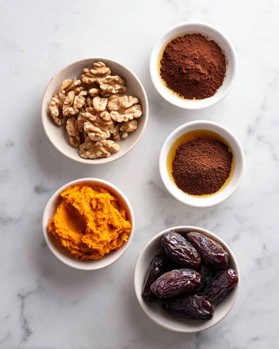 The image shows five small white bowls arranged on a white marbled surface, each containing a different ingredient. Starting from the upper left, one bowl is filled with walnut pieces that are light brown with textured, rough surfaces. To the right of it is a bowl of unsweetened cocoa powder, dark brown and powdery with small clumps. Below the walnuts is a bowl with vanilla extract, smooth and golden amber in color. Next to it on the right is a bowl filled with Medjool dates, dark brown with a glossy, wrinkled texture. Below all these is a bowl containing pumpkin puree, bright orange with a smooth, slightly chunky texture. The scene is bright and clear, highlighting the rich colors and textures of each ingredient. Photo taken with an iphone --ar 4:5 --v 7